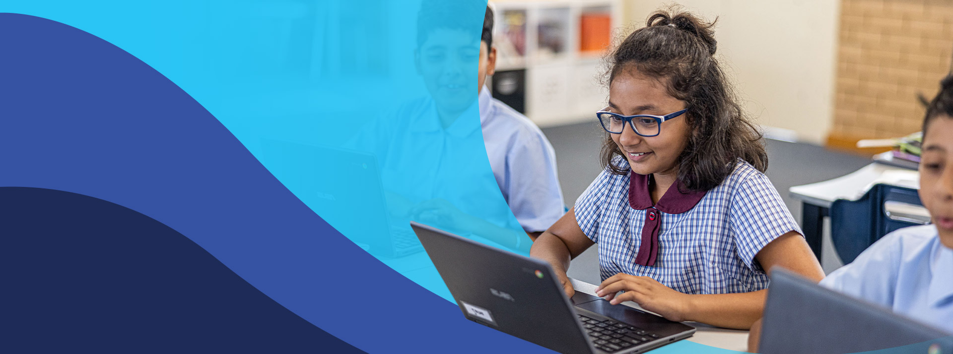 Students using their laptops in the classroom at St John's Primary School Riverstone