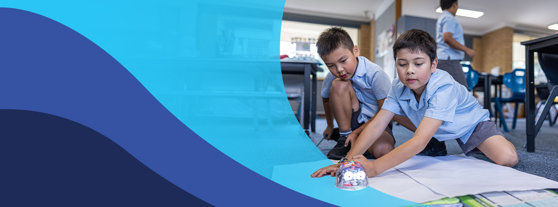 Students programming a bee bot in the classroom at St John's Primary School Riverstone