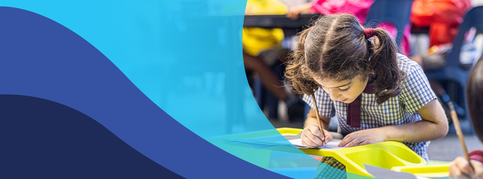 Student writing in the classroom at St John's Primary School Riverstone