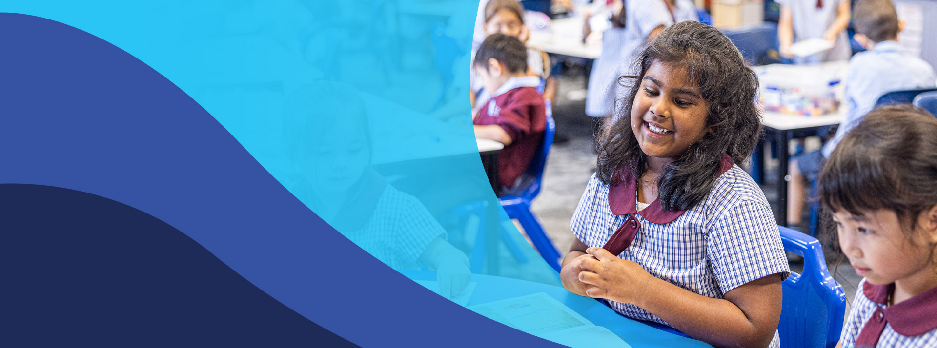 Student smiling with her classmates in the classroom at St John's Primary School Riverstone
