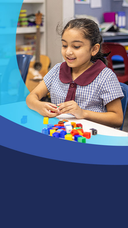 Student learning math in the classroom at St John's Primary School Riverstone