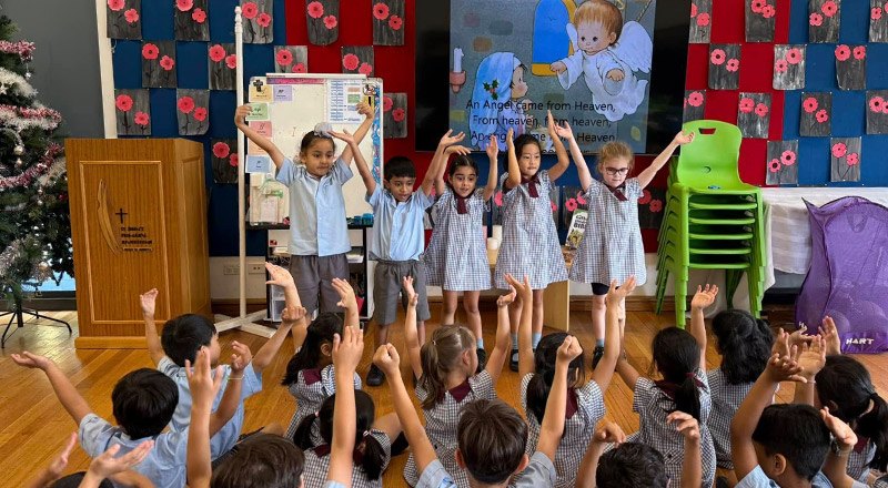Students performing in front of their classmates at St John's Primary School Riverstone