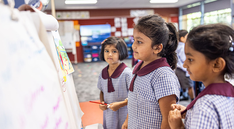 Students brainstorming together in the classroom at St John's Primary School Riverstone