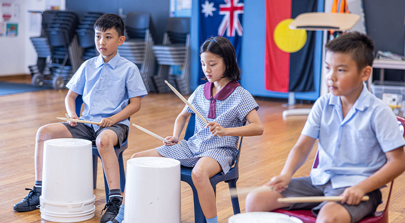 Students learning music at St John's Primary School Riverstone
