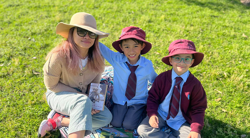 A mum with students at a school event at St John's Primary School Riverstone