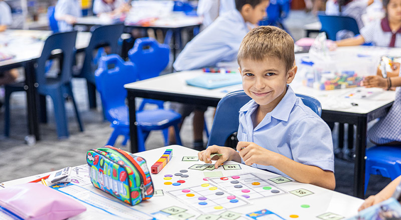 Student learning math in the classroom at St John's Primary School Riverstone
