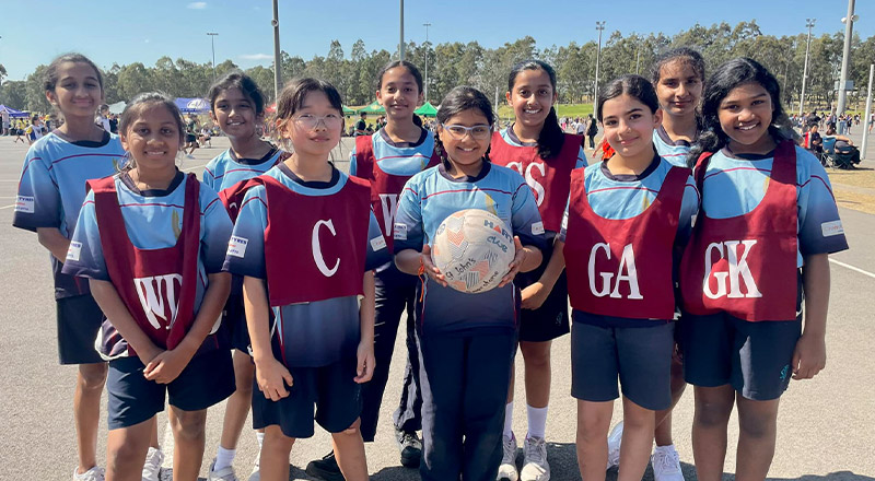 Students representing St John's Primary School Riverstone in netball and a sporting event