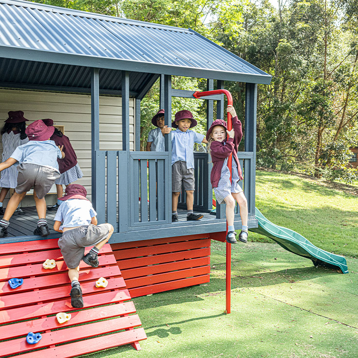 Students playing in the cubby house at St John's Primary School Riverstone