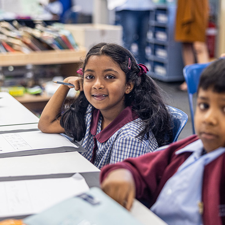 Student sitting in her classroom at St John's Primary School Riverstone