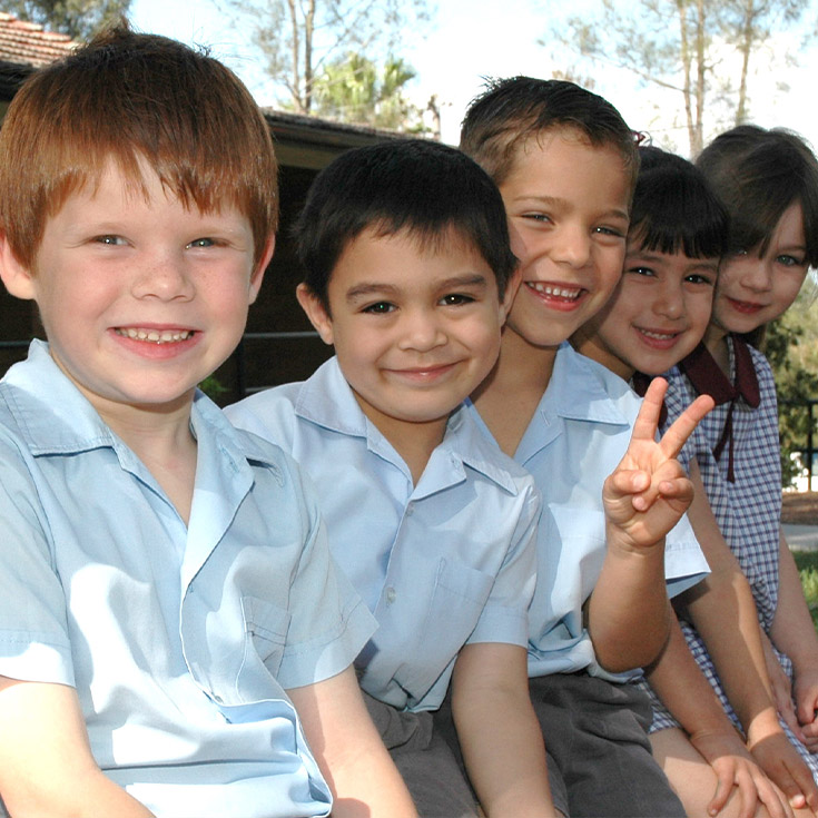 Image of students smiling at St John's Primary School Riverstone in 2005