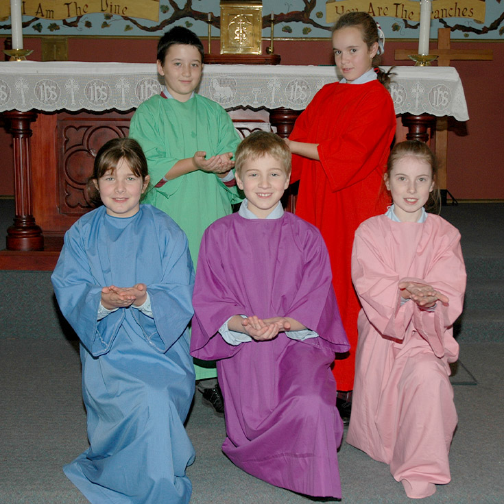 Students wearing colourful robes for a liturgy at St John's Primary School Riverstone in 2006