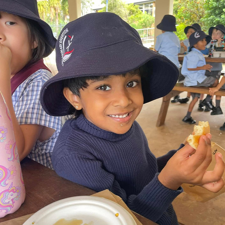 Student eating a pancake at St John's Primary School Riverstone